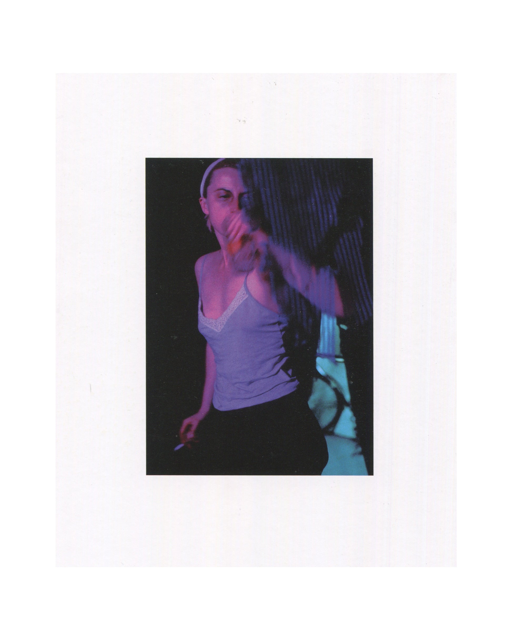 Cindy Sherman, Photographic Work 1975–1995, 1995, interior: colour Untitled #250, 1992 — Sherman in white vest, white headband, purple-lit, hand raised to mouth, dark ground; caption below
