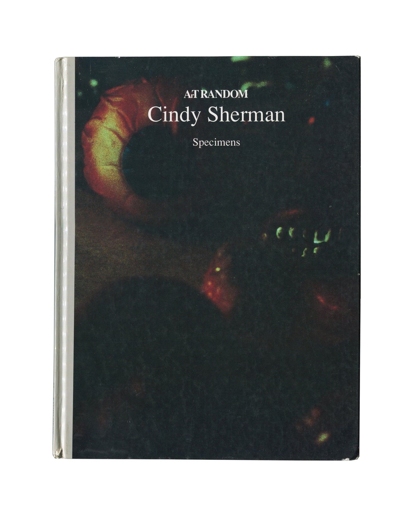 Cindy Sherman, Specimens, Art Random 65, Kyoto Shoin 1991, front cover: black, white serif title, colour close-up of red-orange fleshy form and small dark creature, clear plastic jacket
