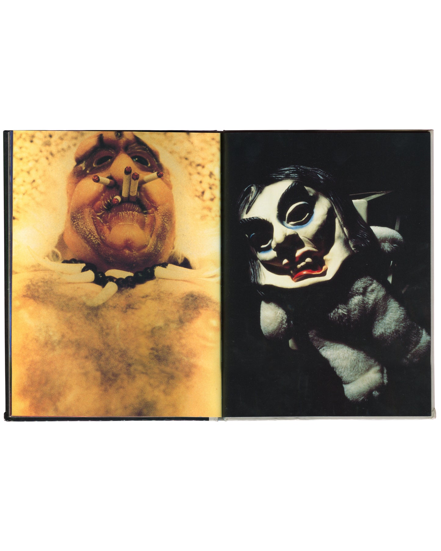 Cindy Sherman, Specimens, Art Random 65, 1991, interior spread: colour — left: extreme close-up of prosthetic face, open mouth, cigarettes as teeth, yellow ground; right: white mask with black eye sockets, red lips, dark fur ground
