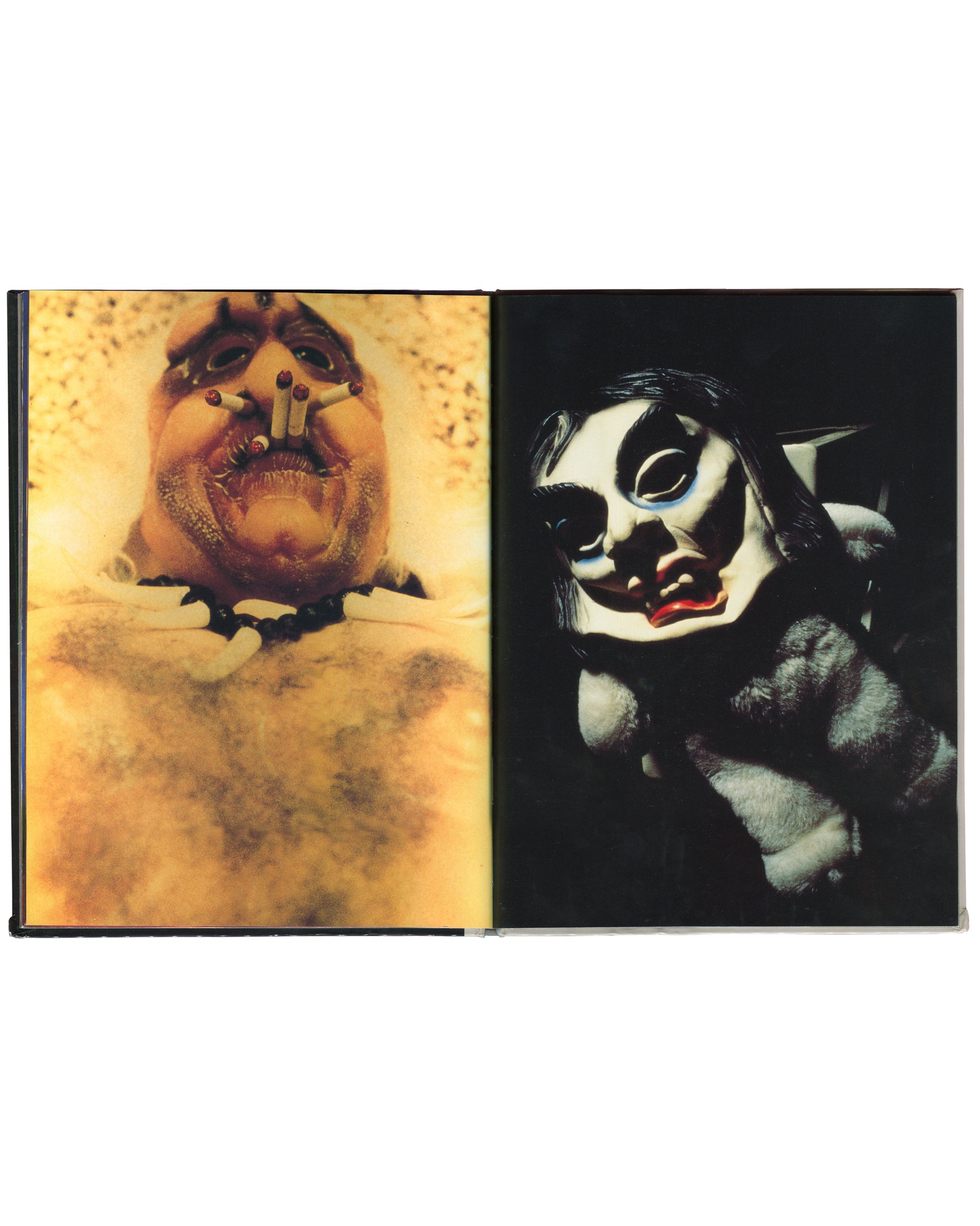 Cindy Sherman, Specimens, Art Random 65, 1991, interior spread: colour — left: extreme close-up of prosthetic face, open mouth, cigarettes as teeth, yellow ground; right: white mask with black eye sockets, red lips, dark fur ground
