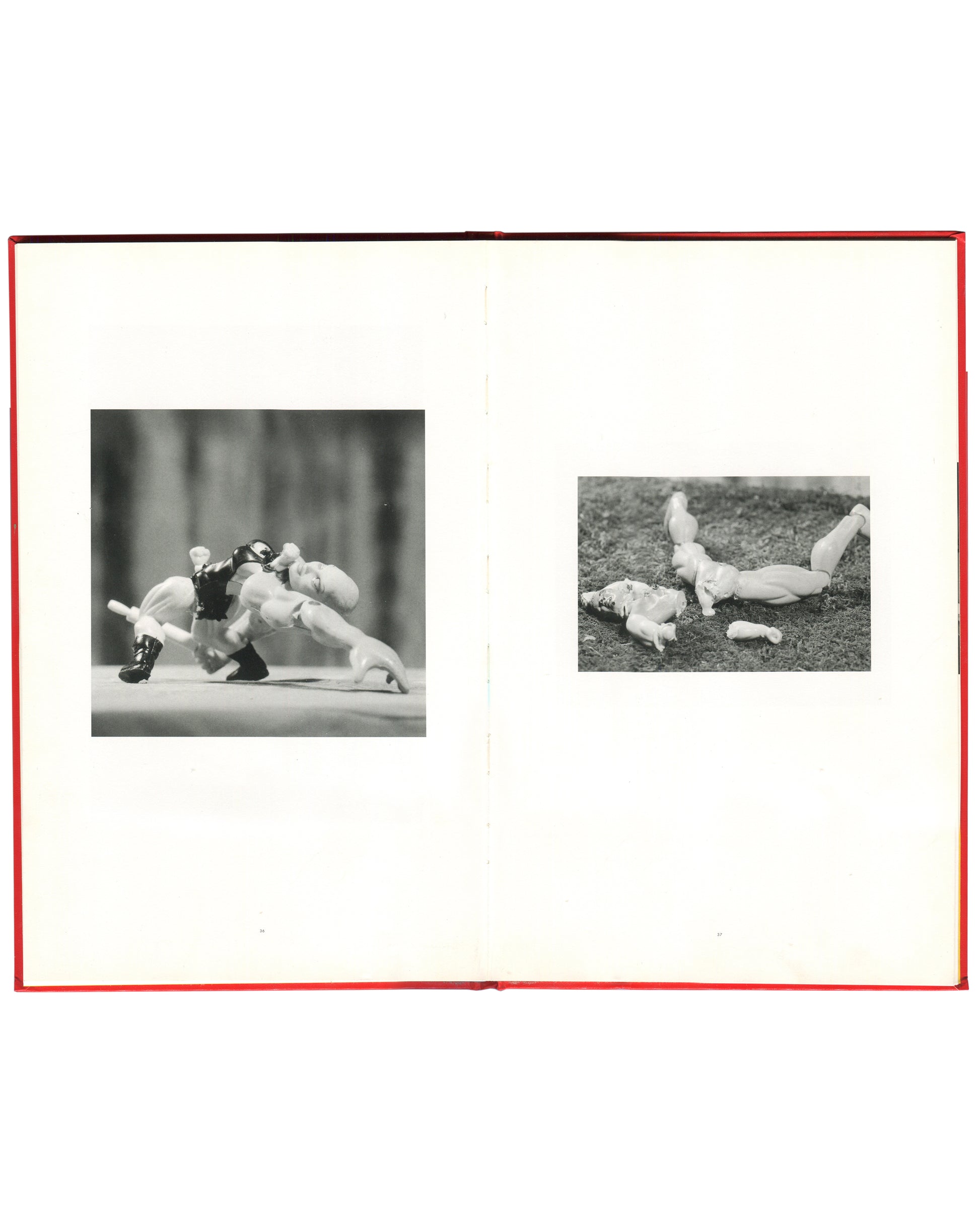 Cindy Sherman, Hasselblad Award 1999, interior spread: two b&w doll works — tangled plastic figures on table; dismembered doll parts scattered on grass

