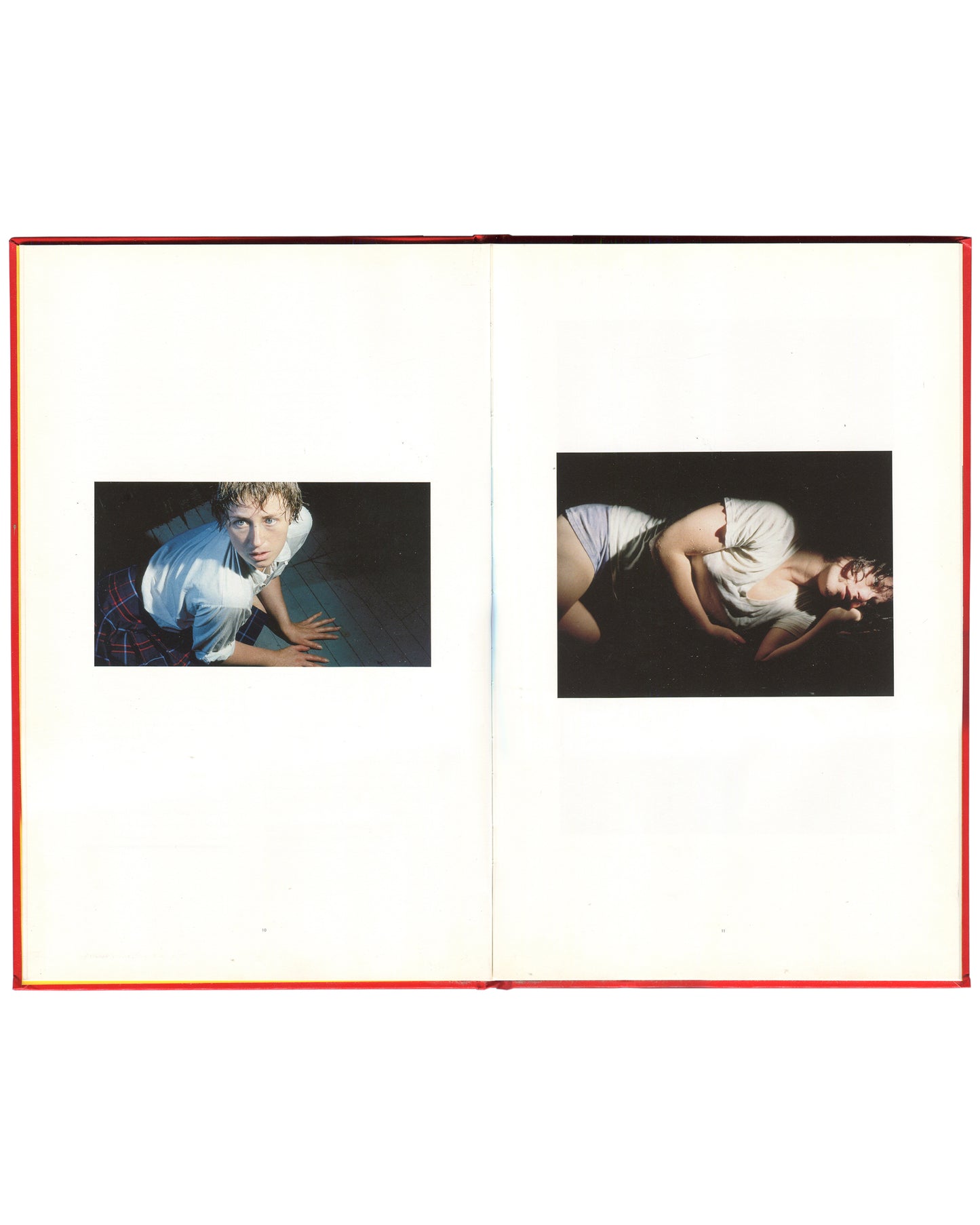 Cindy Sherman, Hasselblad Award 1999, interior spread: two colour works — Sherman crouching in wet white shirt, teal ground; Sherman curled on floor in white shirt, dark ground
I