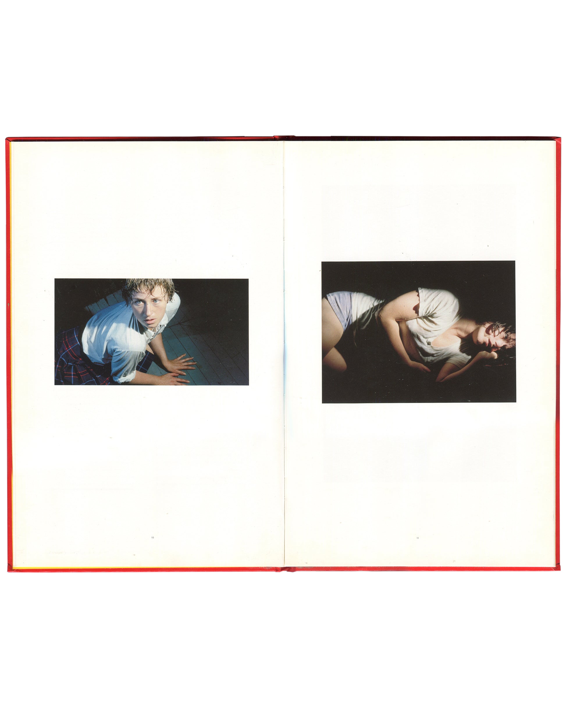 Cindy Sherman, Hasselblad Award 1999, interior spread: two colour works — Sherman crouching in wet white shirt, teal ground; Sherman curled on floor in white shirt, dark ground
I