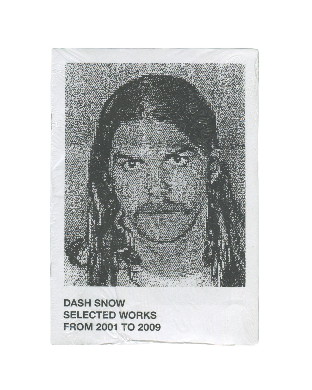 Dash Snow, Selected Works from 2001 to 2009, front cover: white, heavily pixelated b&w portrait of Dash Snow, bold sans-serif title below, creased wrappers
