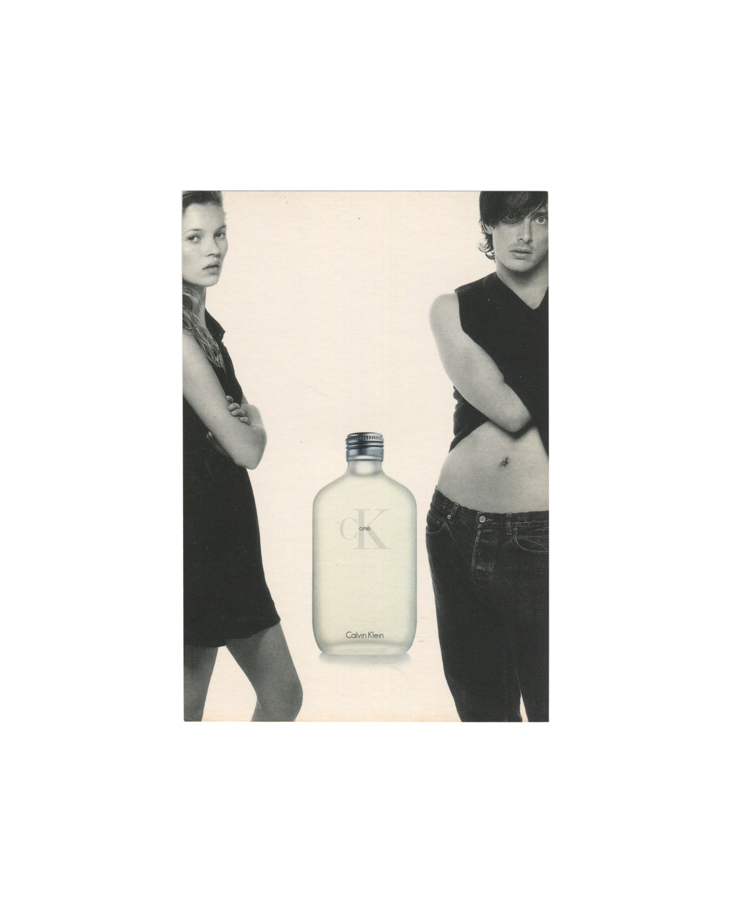 Reverse of 1996 CK One Calvin Klein fragrance promotional postcard showing cream-white card stock with large grey CK One logo at left — overlapping 'c' and 'K' in light grey serif type with 'one' in small lowercase — and tagline 'a fragrance for a man or a woman' in small light grey italic serif type at lower left; vertical dividing line at centre right with standard postcard address fields; copyright line '©1996 Calvin Klein Cosmetics Corporation. Right reserved by CKI' in small print at lower centre; ligh