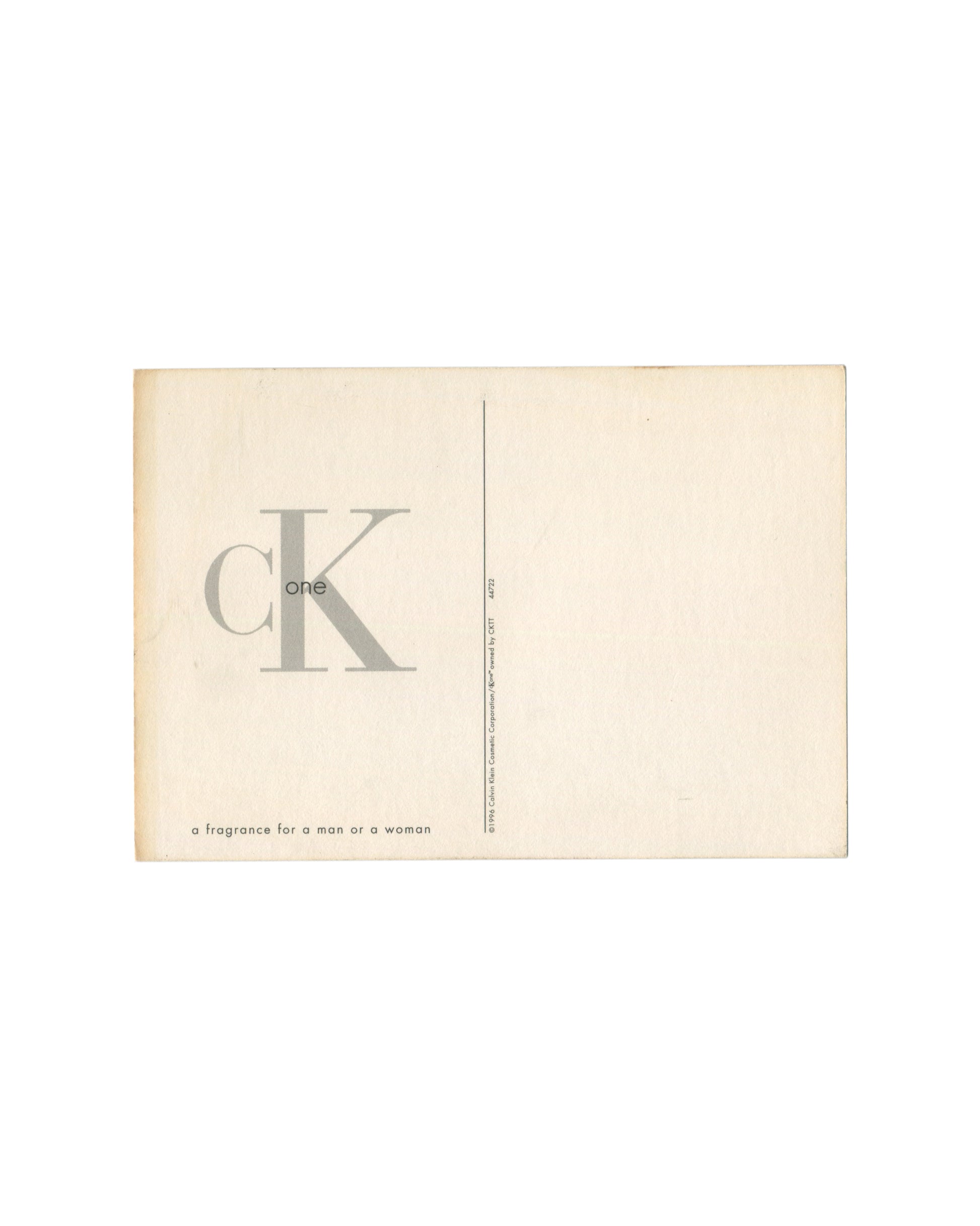 Original 1996 CK One Calvin Klein fragrance promotional postcard, recto showing a black-and-white photograph on pale ground: Kate Moss at left, arms crossed, wearing a dark sleeveless dress, cropped at mid-thigh, looking away from camera; a male figure at right, arms crossed, wearing a dark sleeveless top and low-rise dark jeans with exposed midriff, looking directly at camera; between them at centre, a colour image of the CK One frosted glass bottle with silver cap and 'Calvin Klein' label, floating agains