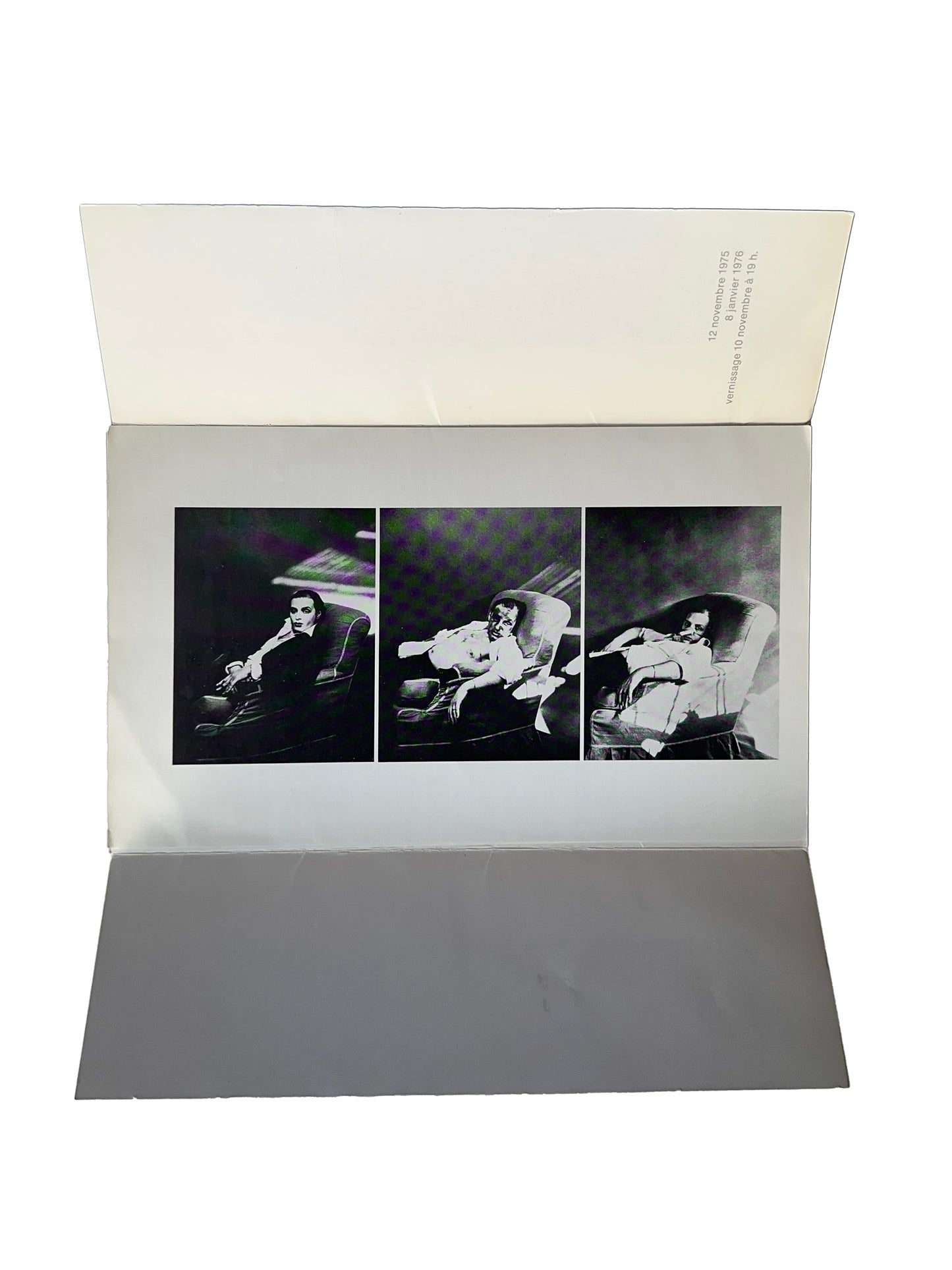 Urs Lüthi exhibition invitation open bifold, Galerie Isy Brachot, Brussels, 1975 — interior showing triptych of black and white self-portrait photographs of the artist reclining, vernissage 10 novembre 1975