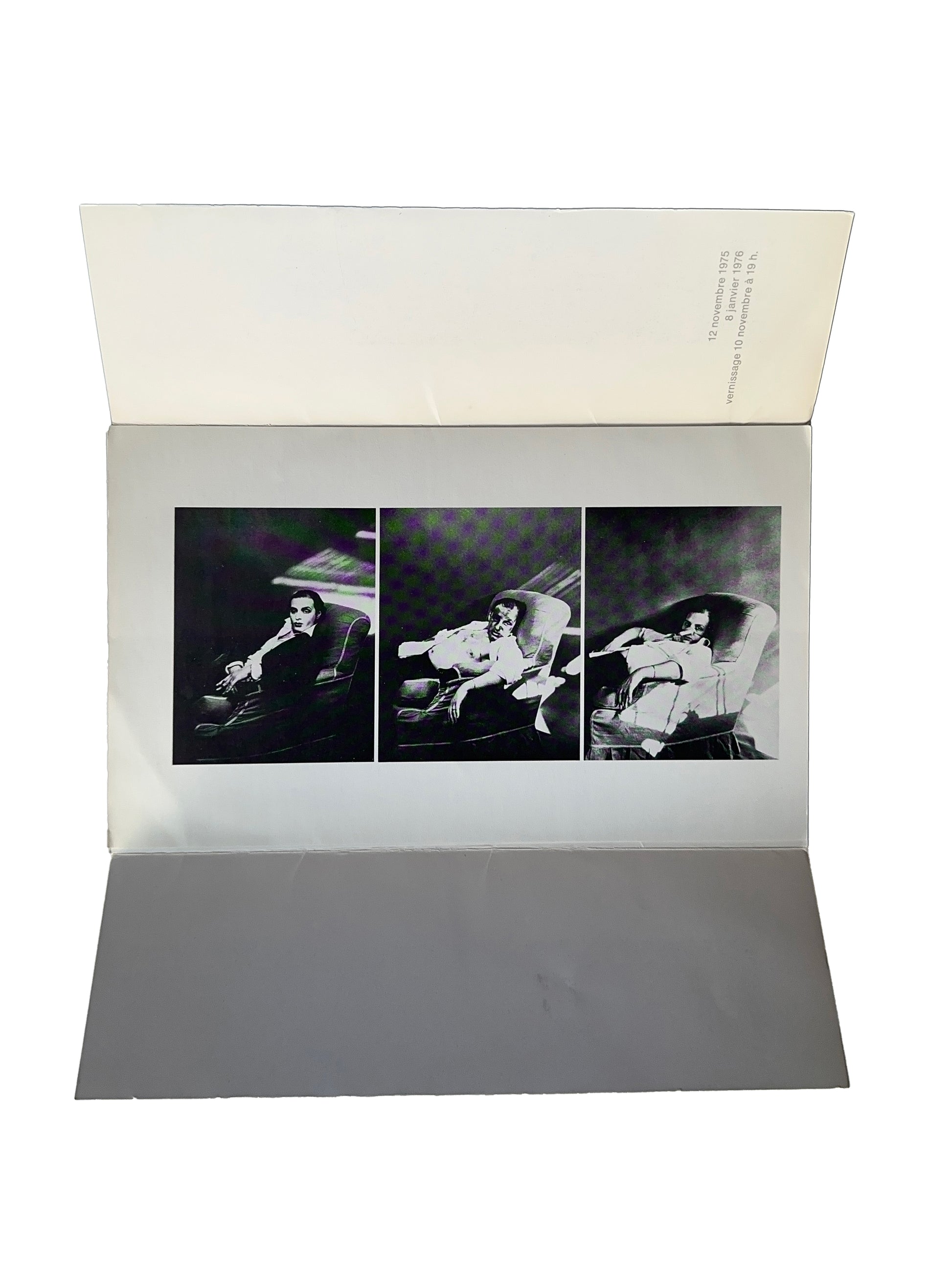Urs Lüthi exhibition invitation open bifold, Galerie Isy Brachot, Brussels, 1975 — interior showing triptych of black and white self-portrait photographs of the artist reclining, vernissage 10 novembre 1975