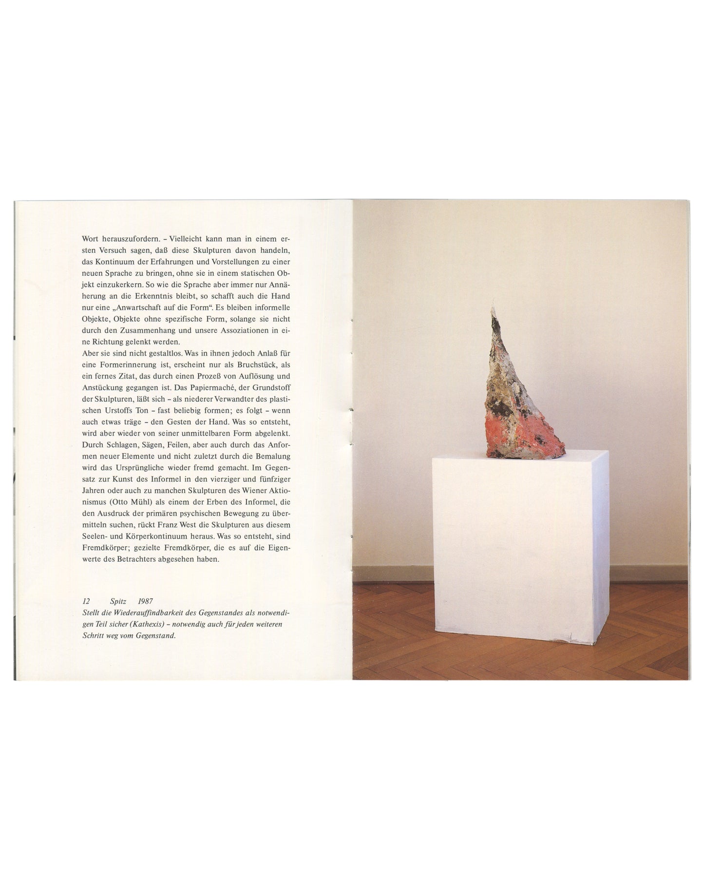 Interior spread, Franz West, Museum Haus Lange, Heft 1, Krefelder Kunstmuseen, Krefeld, 1989. Left page: continuation of Julian Heynen essay 'Fremdkörper und Eigenwerte' in small serif type, two columns; caption lower left '12  Spitz  1987' with italic caption text in German. Right page: colour photograph of Franz West, Spitz, 1987 — tall irregular conical papier-mâché sculpture, surface painted in pale pink, grey, and rust with rough brushwork and texture; placed on a white cubic plinth against a warm cre
