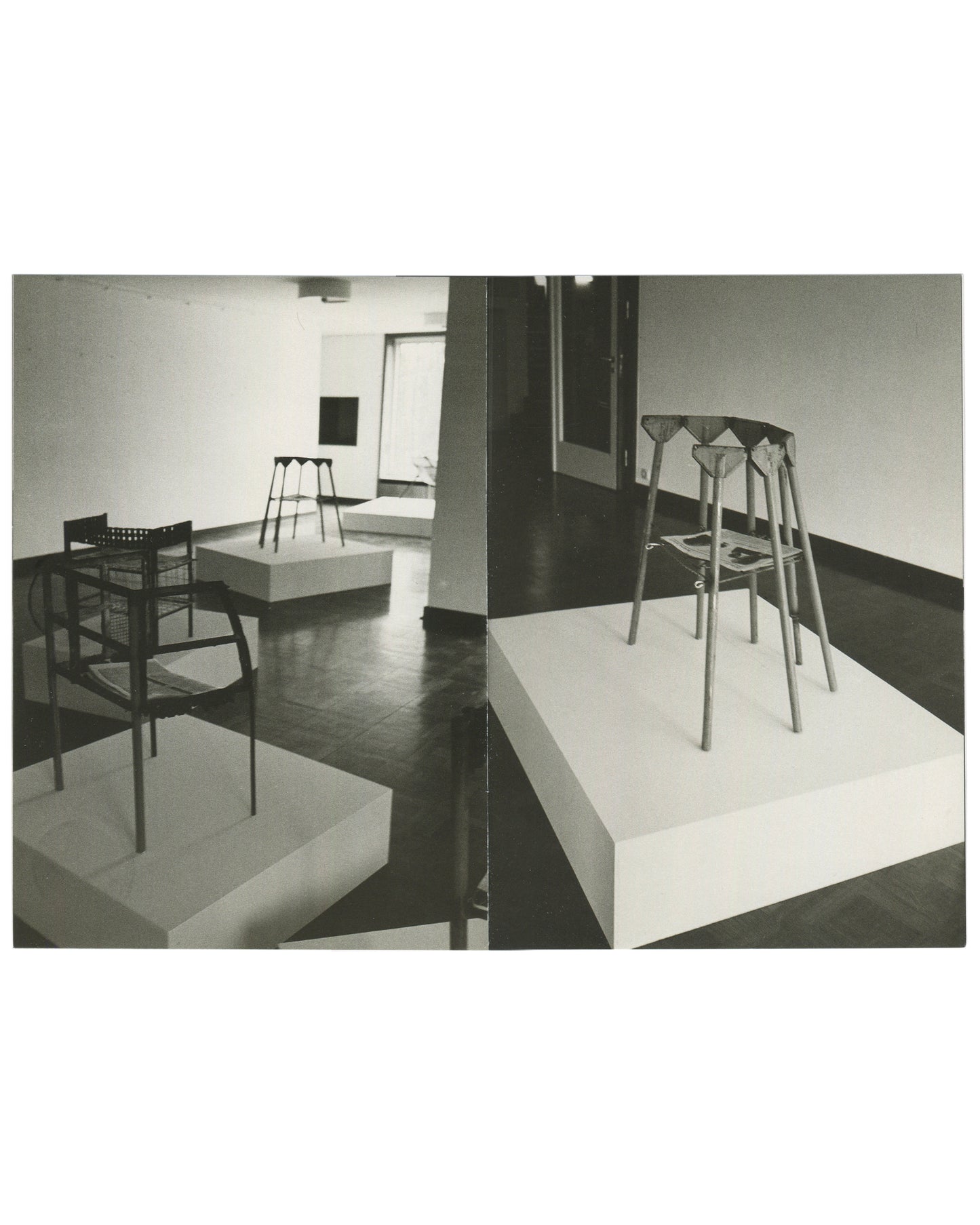 Interior spread, Franz West, Museum Haus Lange, Heft 2, Krefelder Kunstmuseen, Krefeld, 1989. Two black-and-white installation photographs by Günther Förg. Left: gallery room — wire-frame chair and perforated-seat chair on white plinths, tall multi-legged stool form in background, dark reflective floor. Right: close-up of tall multi-legged sculptural stool with folded/draped upper element on white plinth; publications visible on plinth surface.