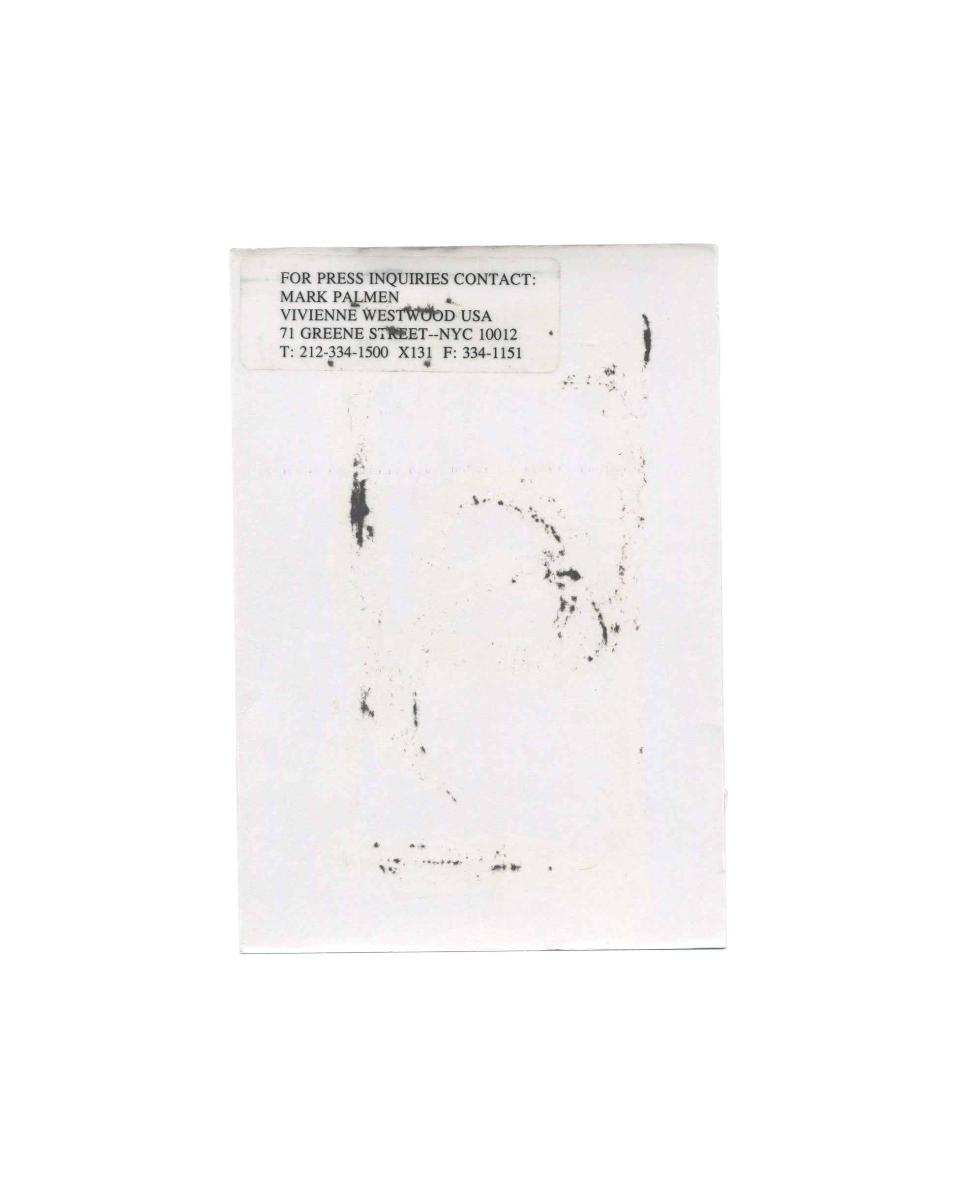  Vivienne Westwood MAN Autumn/Winter 2000–2001 show announcement, reverse, white card with a faint offset ink transfer of the front image visible through the paper; at upper left a typed press contact label reading FOR PRESS INQUIRIES CONTACT: / MARK PALMEN / VIVIENNE WESTWOOD USA / 71 GREENE STREET–NYC 10012 / T: 212-334-1500 X131 F: 334-1151.