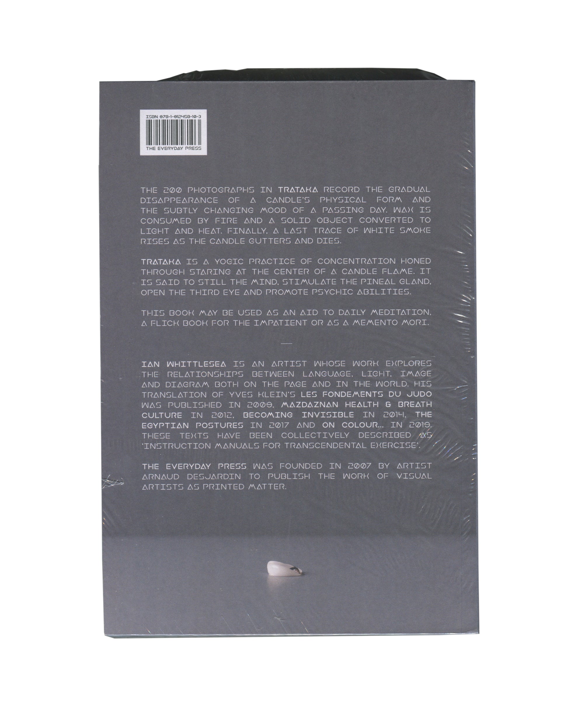 Ian Whittlesea, Trataka, The Everyday Press 2020, back cover: grey ground, white all-caps text describing the work and artist; ISBN barcode upper left; shrinkwrap visible
