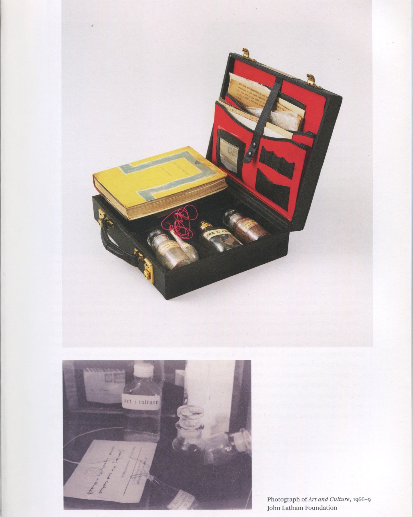 John Latham, Art and Culture, 1966–9, in Conceptual Art in Britain 1964–1979, Tate 2016 — open black briefcase: yellow Clement Greenberg book, three glass jars, red cord, red-lined lid with documents; b&w photograph below