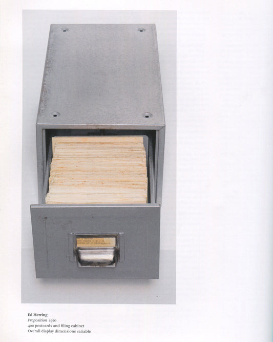Ed Herring, Proposition, 1970, in Conceptual Art in Britain 1964–1979, Tate 2016 — open metal filing cabinet drawer packed with 400 aged postcards; caption below