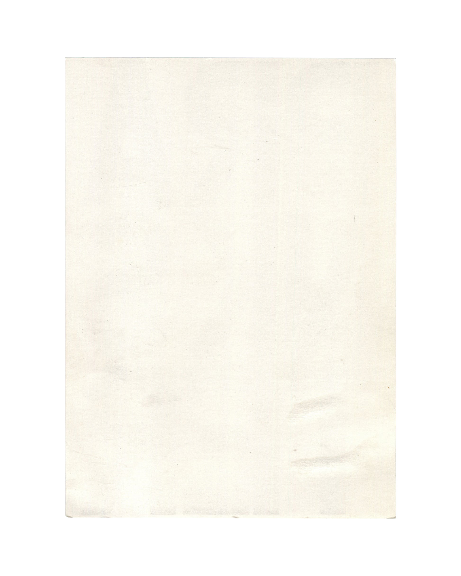 Reverse of c. late 1980s–early 1990s Christopher Wool Prankster graphic card showing plain cream-white card stock, blank, with light age toning, soft surface marks, minor creasing, and faint discoloration consistent with period printed ephemera and archive storage.