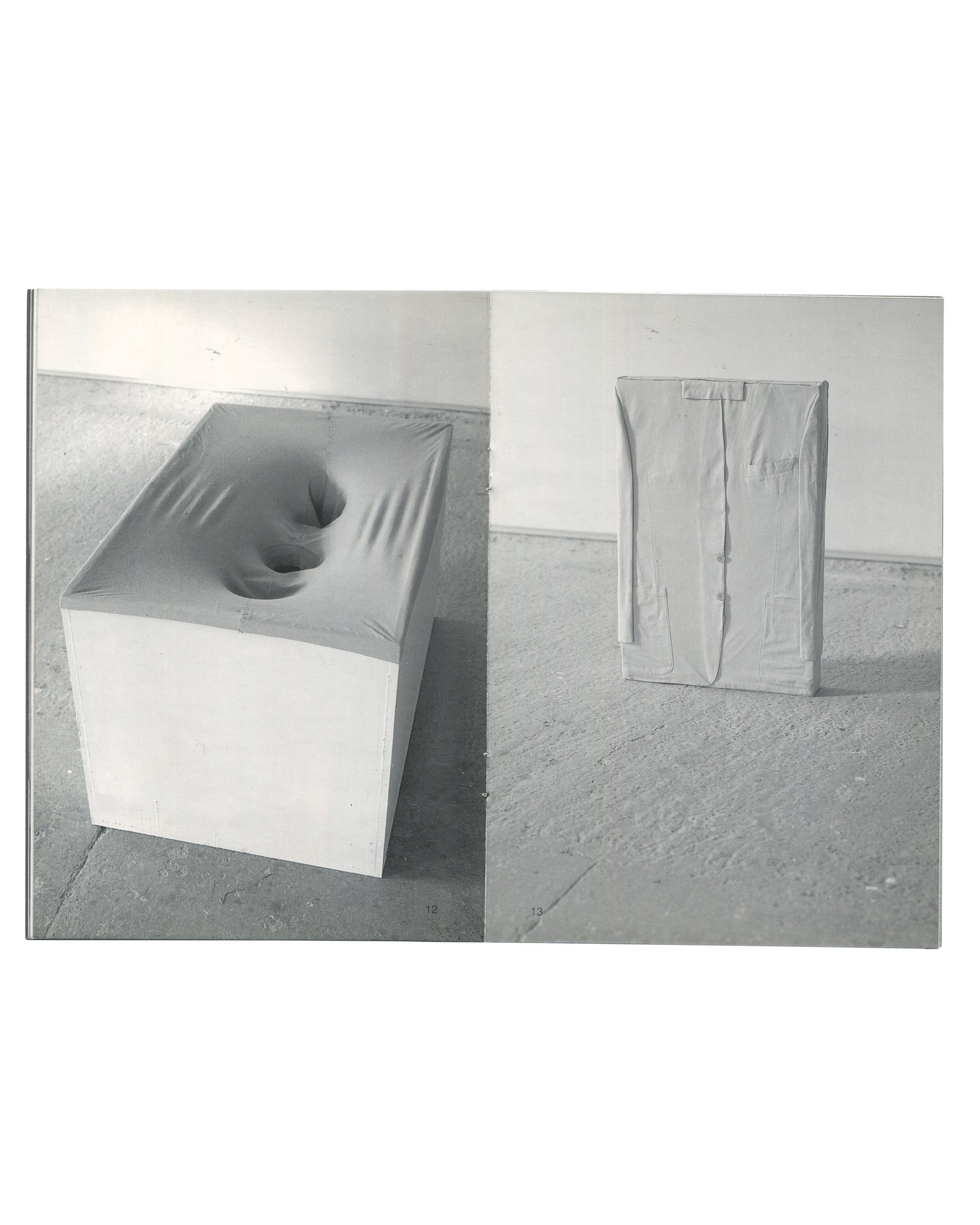 Interior spread of Erwin Wurm, Kunstverein in Hamburg / Villa Arson, 1993, showing two black-and-white photographs: left page showing a white rectangular plinth with a large hand-shaped indentation pressed into its upper surface, right page showing a white rectangular form wrapped tightly in fabric with visible seams and fastenings, standing upright in a gallery space.

