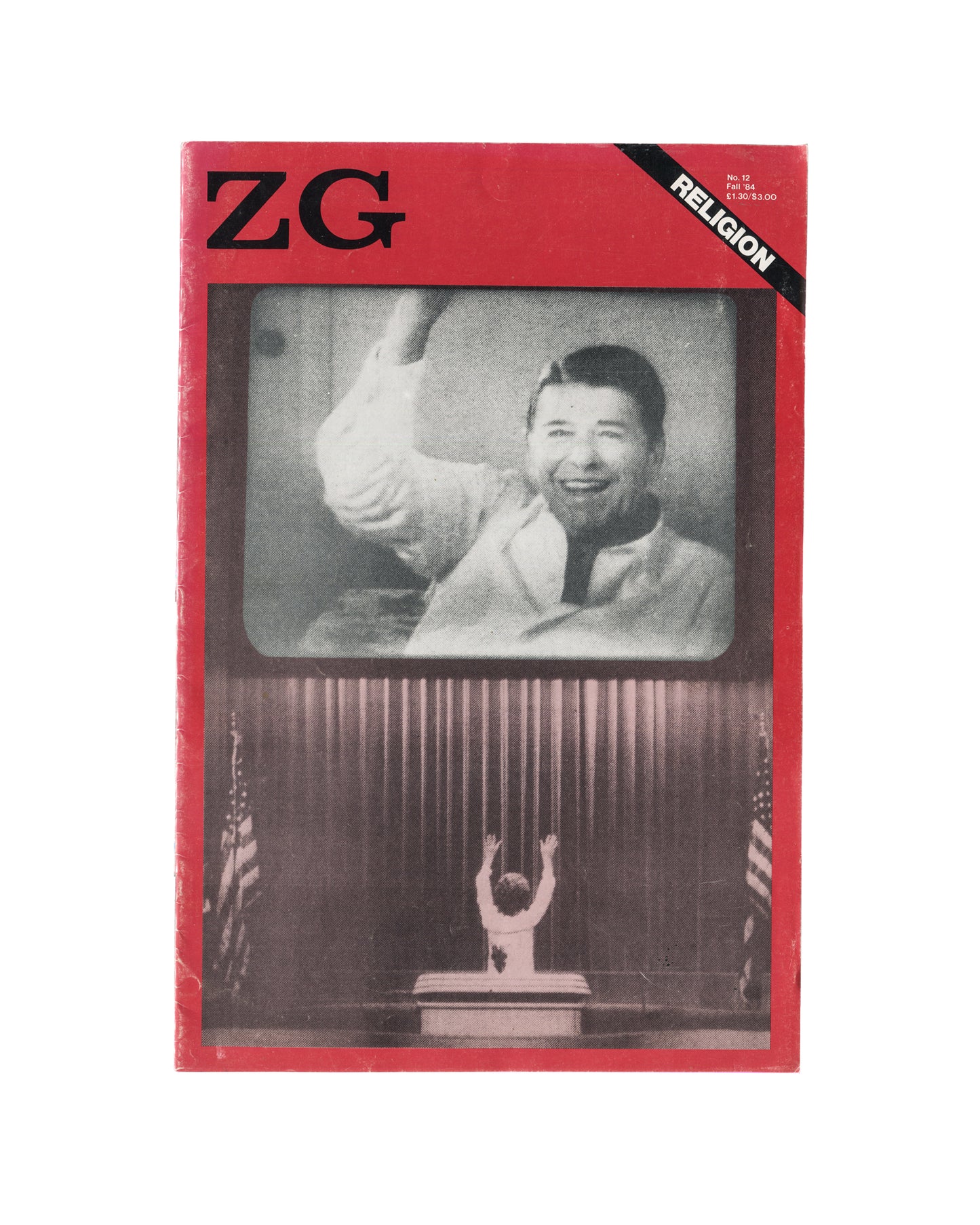 Magazine cover, ZG Magazine No. 12: Religion, edited by Rosetta Brooks, New York, Fall 1984. Offset-printed, staple-bound periodical, 41.9 × 27.9 cm. Red ground. Upper left: bold black 'ZG' logotype. Upper right: black diagonal band — white bold sans-serif 'RELIGION'. Centre: black-and-white photograph of a television set showing a smiling male figure in white jacket raising one arm — televangelist or political figure; below the TV screen: small silhouetted figure with arms raised before a podium, flanked b